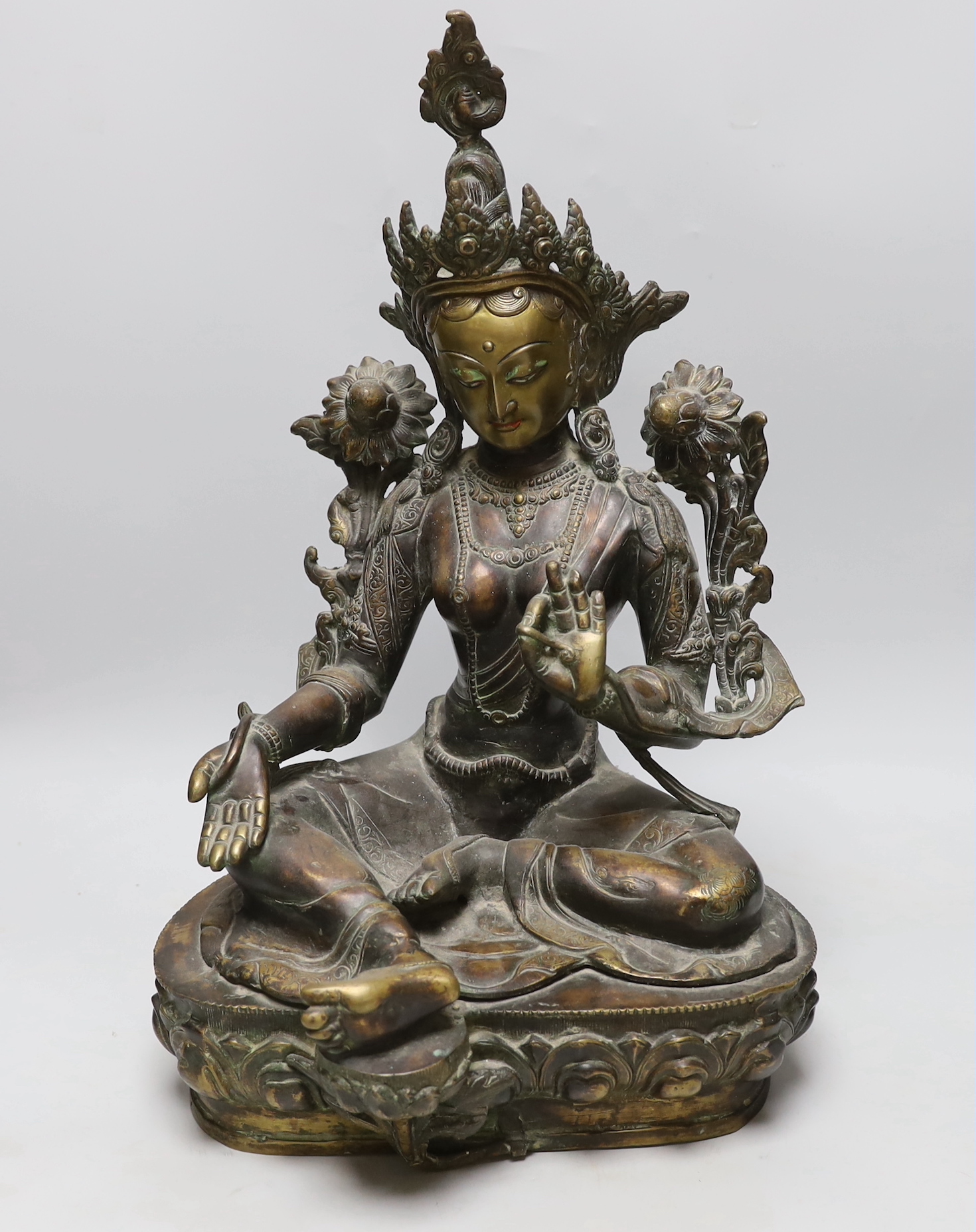 A large Sino-Tibetan bronze of Green Tara, 49cm high